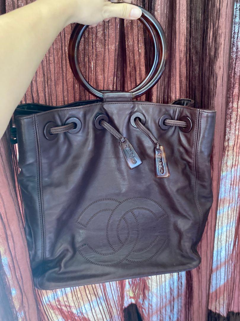 Vintage Chanel leather drawstring bucket bag, Women's Fashion, Bags &  Wallets, Tote Bags on Carousell