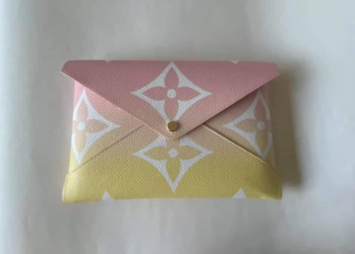 Kirigami Pochette (Category: Luxury Bags & Wallets) located in Manila. Submitted by bagislifeshop (Listing ID 1084309887, Image 2). Description: Limited Summer 2021 Collection Giant monogram canvas Pink color gradations with Yellow flash detailed Gold tone hardware Largest size, holds a tablet Can use as clutch bag Dimensions-9”x6.5” Comes w/ receipt, tag Dustbag and box.