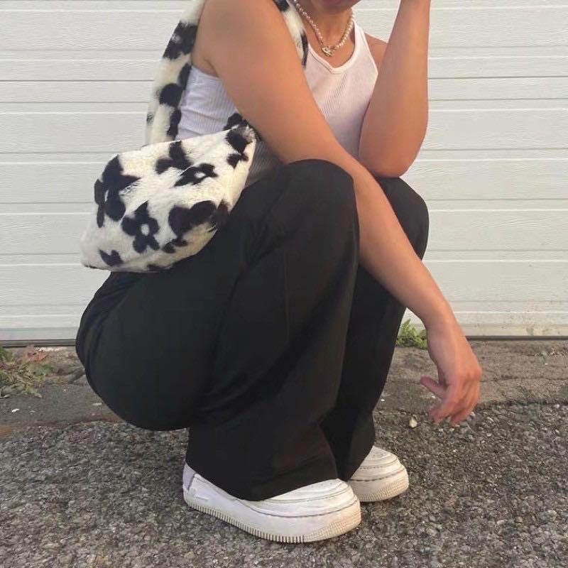 fluffy white bag with black flowers