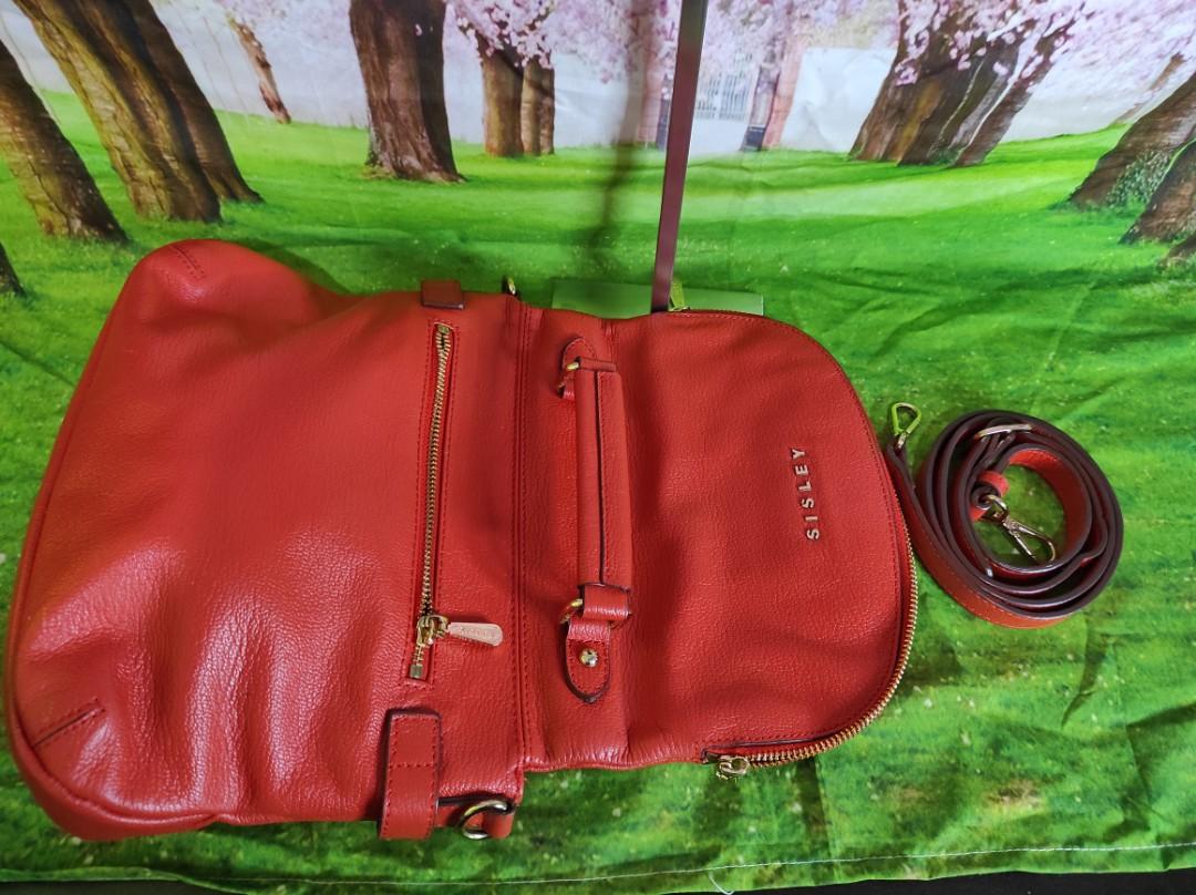 Original Sisley 2 way bag (Category: Cross-body Bags) located in Quezon City. Submitted by icurateshoppe (Listing ID 1079292076, Image 2). Description: Original Sisley 2 way hand and sling bag Orange Almost new but preloved so expect some signs of usage Super nice in person Rubber linings intact. With small white dots lang as shown in the photo and visible lang pag tinutukan. From afar naman everything looks good..