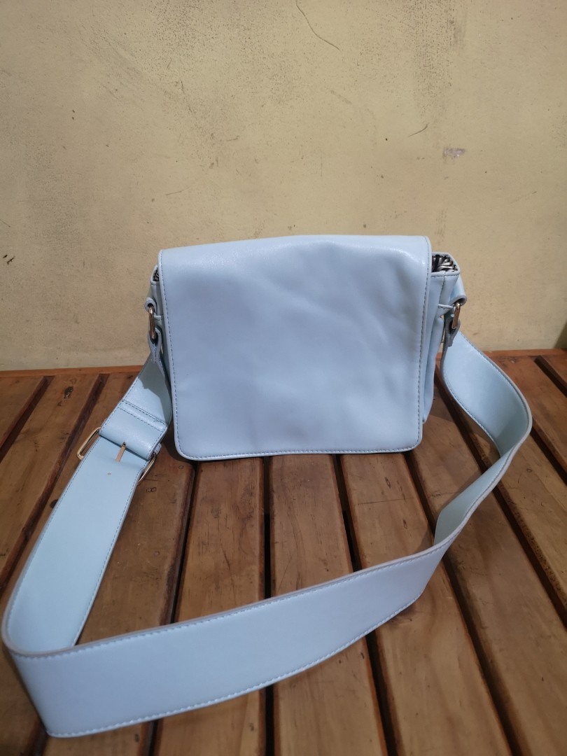 light blue messenger bag