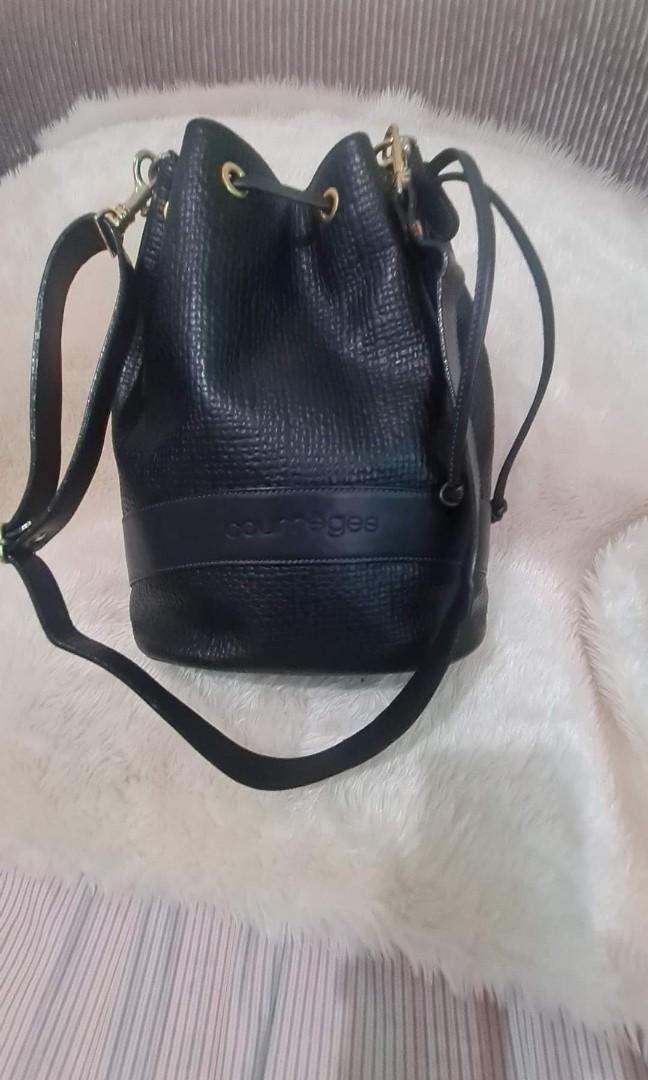 Authentic Courreges Paris 3-Way Bag (Category: Luxury Bags & Wallets) located in Quezon City. Submitted by lix12 (Listing ID 1084901152, Image 3). Description: 💯 Authentic ❣May be used as a shoulder/crossbody bucket bag and backpack. ❣Color: Black ❣Size: Medium ❣Measurements: 12'L x 11'H x 6'W ❣ With detachable straps and with slightly tarnished hardwares as sign of usage. ❣Has inner middle zipper compartment ❣Good condition ❣Made in France 🇫🇷