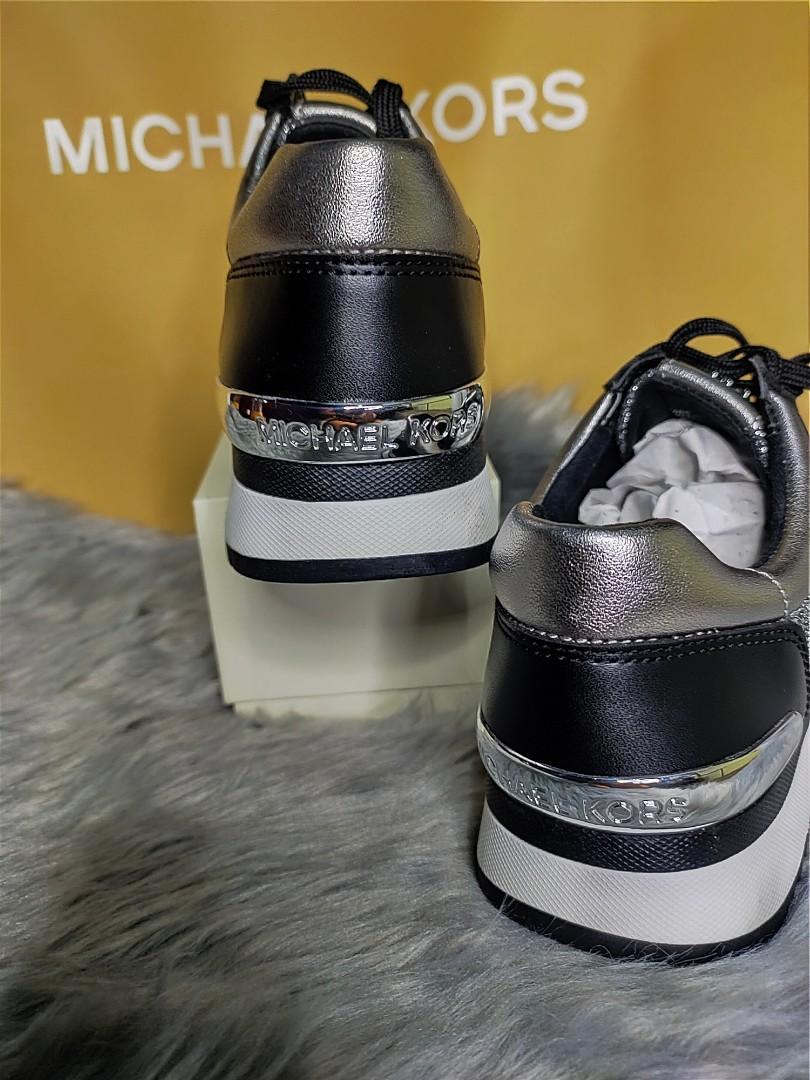 Michael kors black top and silver trainers
