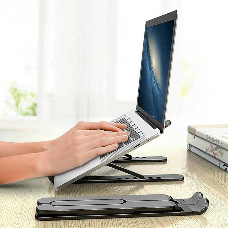 ADJUSTABLE FOLDABLE LAPTOP STAND (Category: Laptops & Notebooks) located in Manila. Submitted by christimjose09 (Listing ID 1079489529, Image 2). Description: Product details: ✔️Our laptop holder is compatible with all laptops from 10-15.6 inches. ✔️Can absorb and discharge heat easily. The hollow design and forward-tilt angle offers great heat dissipation and natural airflow to prevent your laptop from overheating. ✔️With its lightweight and fol