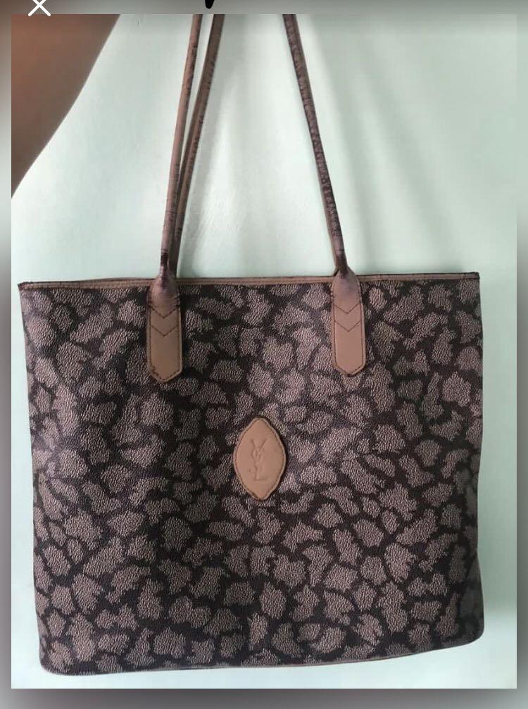 TOTE BAG (Category: Luxury Bags & Wallets) located in Quezon City. Submitted by yumiizashop (Listing ID 1079568832, Image 1). Description: 100% original YSL project bag flaws on leather part only interior is good and body is good flaws on leather handle and leather lining.