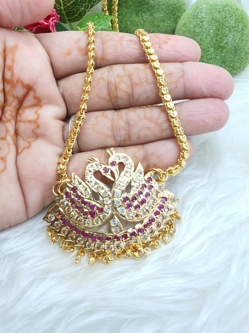 Gold chain top with peacock pendant