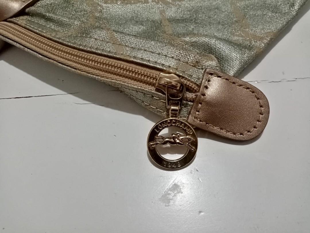 Longchamp (Category: Luxury Bags & Wallets) located in Quezon City. Submitted by maksipreloveditems (Listing ID 1080021274, Image 3). Description: LONGCHAMP Color: Gold - USED CONDITION - PEELING SA BODY * Item is in Cebu City. PLEASE READ: Photos posted are FINAL. NO "When Worn Photos" request please. Flaws were mentioned in the description and shown in the pictures posted. Dimensions: Shoulder: Arms: Length: 18.50 inches Width: 7.50 inches Heig