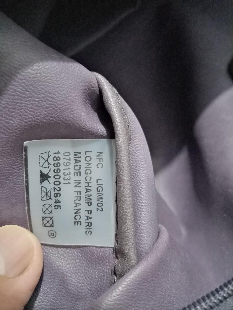 Longchamp (Category: Luxury Bags & Wallets) located in Quezon City. Submitted by maksipreloveditems (Listing ID 1080023436, Image 3). Description: LONGCHAMP Color: PURPLE - USED CONDITION - FADED HANDLES DUE TO STORAGE. NEEDS RECOLOR * Item is in Cebu City. PLEASE READ: Photos posted are FINAL. NO "When Worn Photos" request please. Flaws were mentioned in the description and shown in the pictures posted. Dimensions: Shoulder: Arms: Length: 18.50 