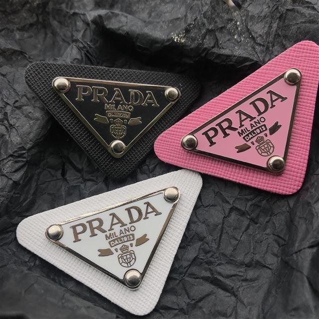 Prada Brooch (Preorder) (Category: Luxury Accessories) located in Malabon City. Submitted by designerarchives.ph (Listing ID 1080360965, Image 3). Description: Colors: Black, White Add 200 if you want with box 50% Downpayment required to order Buyer will shoulder the shipping 1-2 weeks ETA Tags: Chanel Brooch.