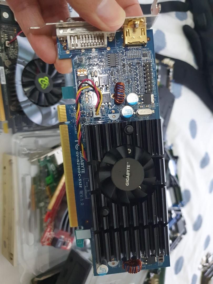 A pile of old Computer parts. GPU cards, network cards, old mobo, etc