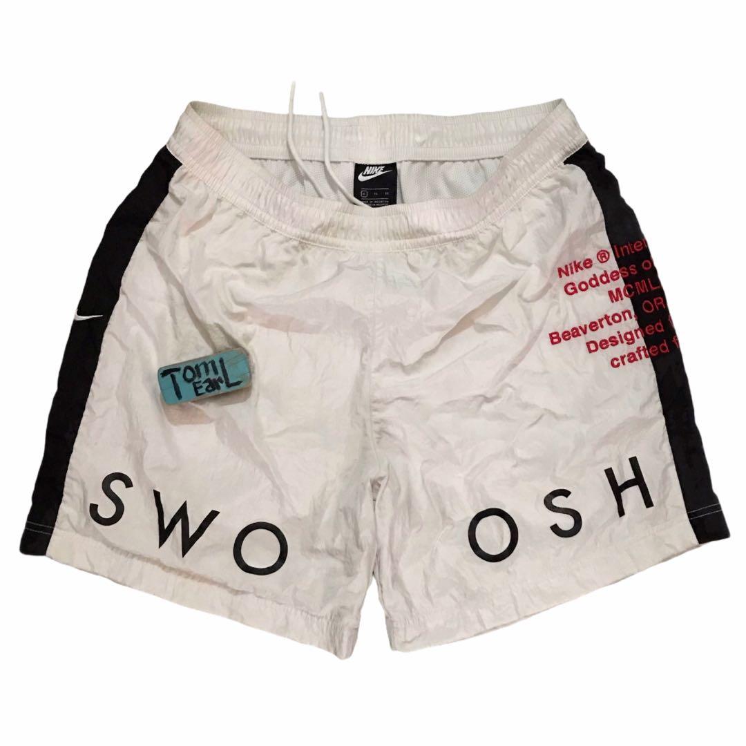 Nike woven swoosh hotsell shorts