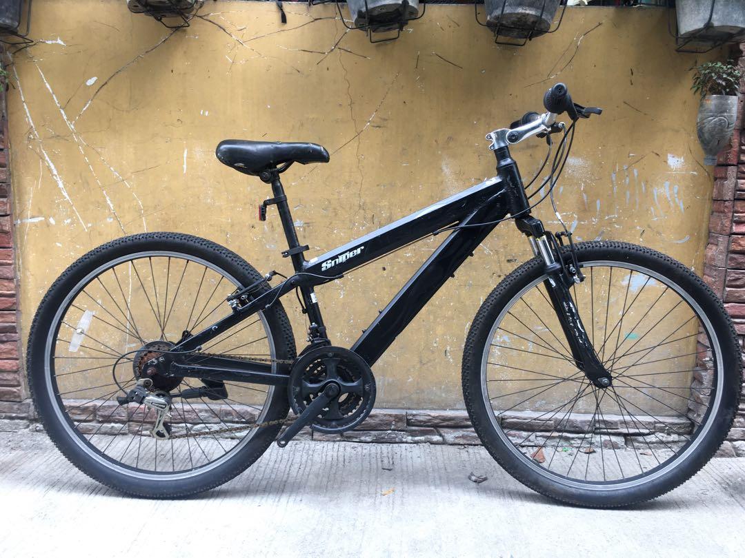 Tradea Sniper Mountain Bike (Category: Bicycles) located in Caloocan City. Submitted by japansurpluscaloocansouth (Listing ID 1080390486, Image 1). Description: Tradea Sniper Mountain Bike Aluminum frame, Disc Brake Ready Size 14”. 54 cm top tube Zoom fork front suspension 80 mm travel V-brakes Promax Adjustable aluminum stem Aluminum handlebar Shimano Revoshift. 6x3 Shimano front derailleur Triple crankset Shimano Sis Rear derailleur 6 spd Doubl