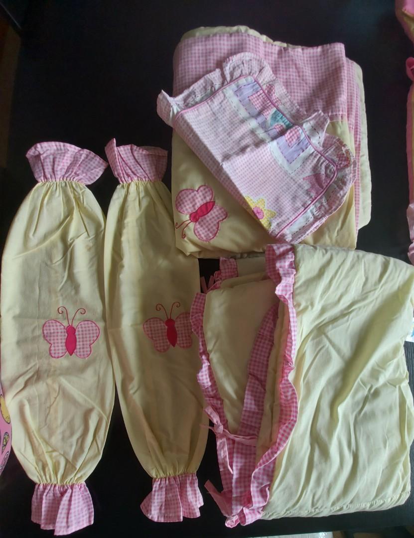 5 pc Baby girl crib bedding set (Category: Cots & Cribs) located in Quezon City. Submitted by jacqueline_velasco14 (Listing ID 1086714521, Image 1). Description: includes comforter, crib bumper, head pillow case and 2 bolster pillow case note few stains on the comforter that can still be washed. payment via bpi or gcash.