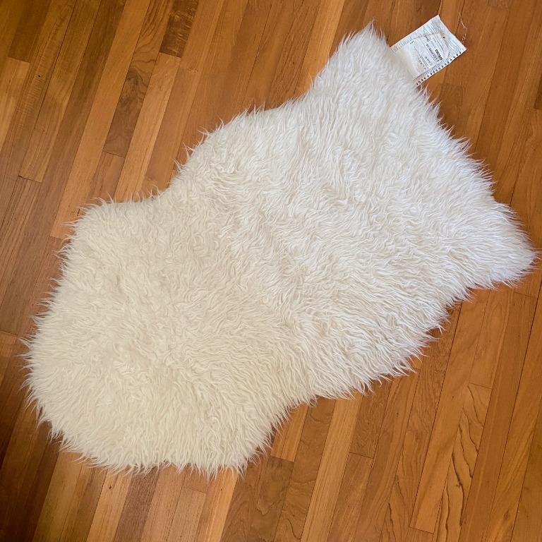 IKEA TEJN FAUX SHEEPSKIN RUG IS SUPER SOFT,WARM IDEAL ON FLOOR ACROSS ARMCHAIR 