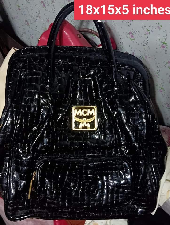 MCM Crocskin travel bag (Category: Luxury Bags & Wallets) located in Caloocan City. Submitted by drum_beater (Listing ID 1083871865, Image 1). Description: duffle type patent leather brass hardwares Approx : 18x15x5 inches.