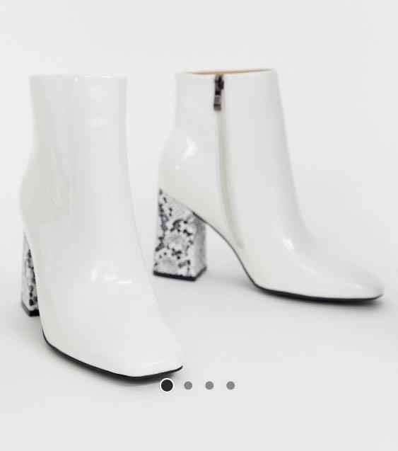 White boots with snakeskin heels
