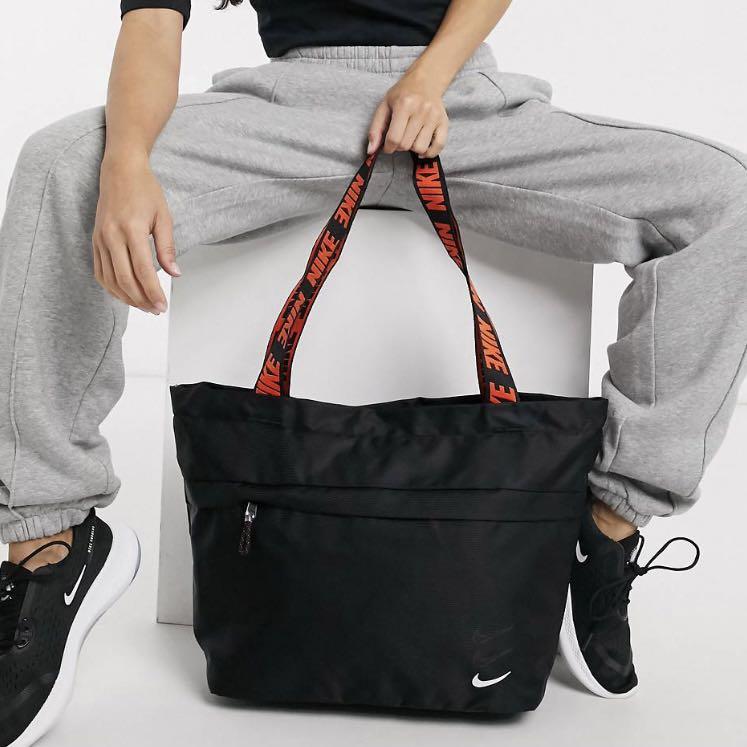 Nike tote bag in black with orange taping strap