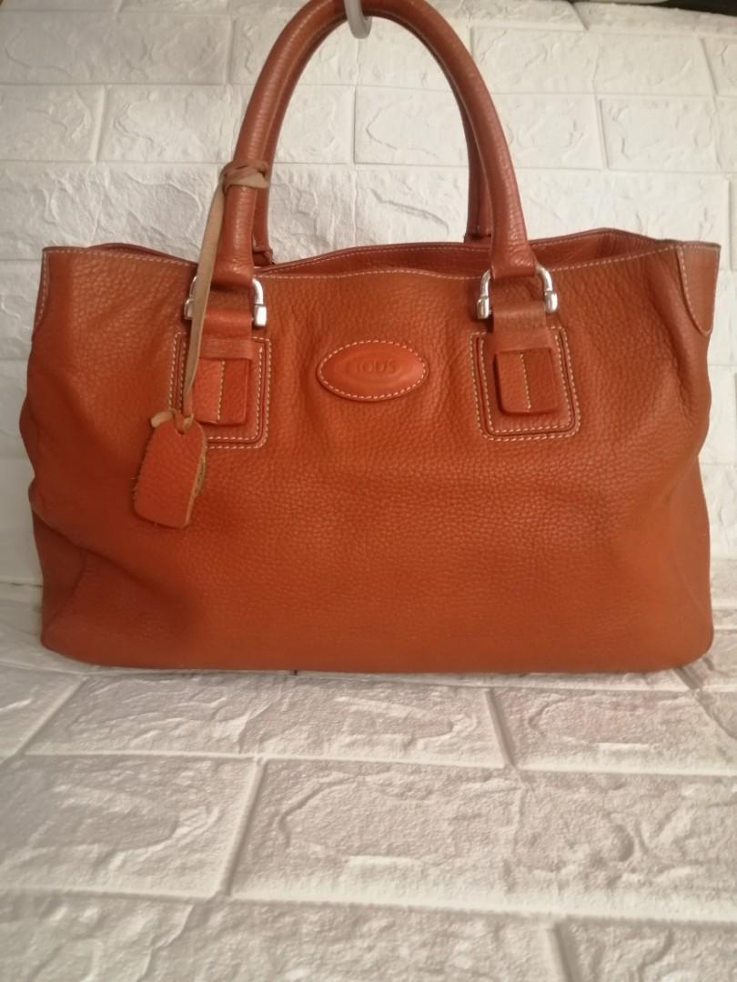 Tod's Vintage Leather Shoulder Bag (Category: Luxury Bags & Wallets) located in Las Pinas. Submitted by etoksi1234 (Listing ID 1087175887, Image 1). Description: Pre-loved TOD'S vintage bag... Last pic for reference only of the price... Minimal signs of usage... Magnetic Closure... Size: L-14" X H-9" x D-6" Please manage your expectations. All sales are final. Kindly examine pictures carefully when buying online. No return, exchange policy....