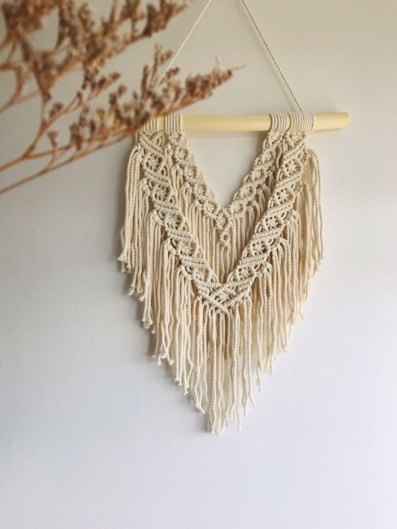 Macrame Wall Hanging (Category: Wall Decor) located in Quezon City. Submitted by loveworn (Listing ID 1087526660, Image 1). Description: Macrame wall hanging made from 2mm quality cream cotton cord 16in wooden dowel Length from dowel to bottom is 20in :).