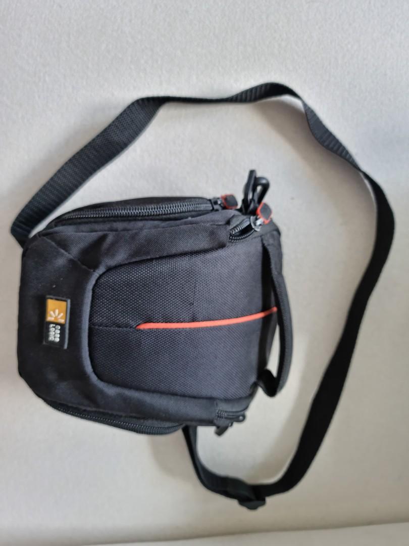 Case Logic Camera Bag (Category: Camera Bags & Carriers) located in Pasig City. Submitted by shedecluttrs (Listing ID 1087894566, Image 3). Description: - Case Logic DCB-304A Compact System/Hybrid Camera Case (Black) - Slightly used.