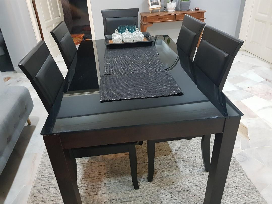 Dining Table Set (Category: Chairs) located in Kuala Lumpur. Submitted by emansobri (Listing ID 1088002810, Image 3). Description: Table Set for sale. 1 Wooden Frame, Glass Top table 6 chairs Condition 6/10 (1 Chair needs to be repair) contact me to arrange delivery (0134826428).