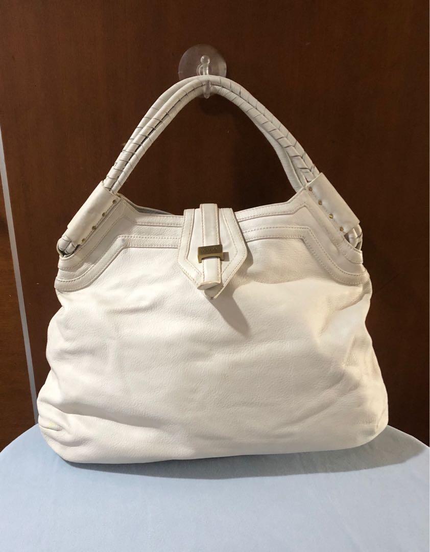 Botkier white leather bag (Category: Luxury Bags & Wallets) located in Quezon City. Submitted by sunlaymac (Listing ID 1088160349, Image 1). Description: Authentic. Botkier white leather bag with matte gold hardware Large sized. Approximate 14x22x5.5in not including strap drop. Manage your expectations. As with pre owned, this has scuffs, stains, marks etc but leather and hardware in good and working condition .