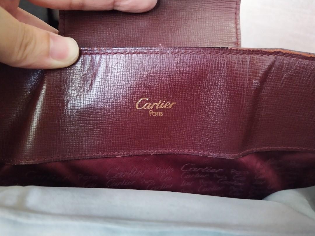 Authentic Cartier Bag (Category: Luxury Bags & Wallets) located in Makati City. Submitted by drawerph (Listing ID 1088161082, Image 2). Description: Burgundy Cartier Shoulder bag with 2 main compartments, and a middle zipped compartment.