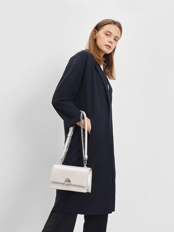 Metallic ring push lock store bag