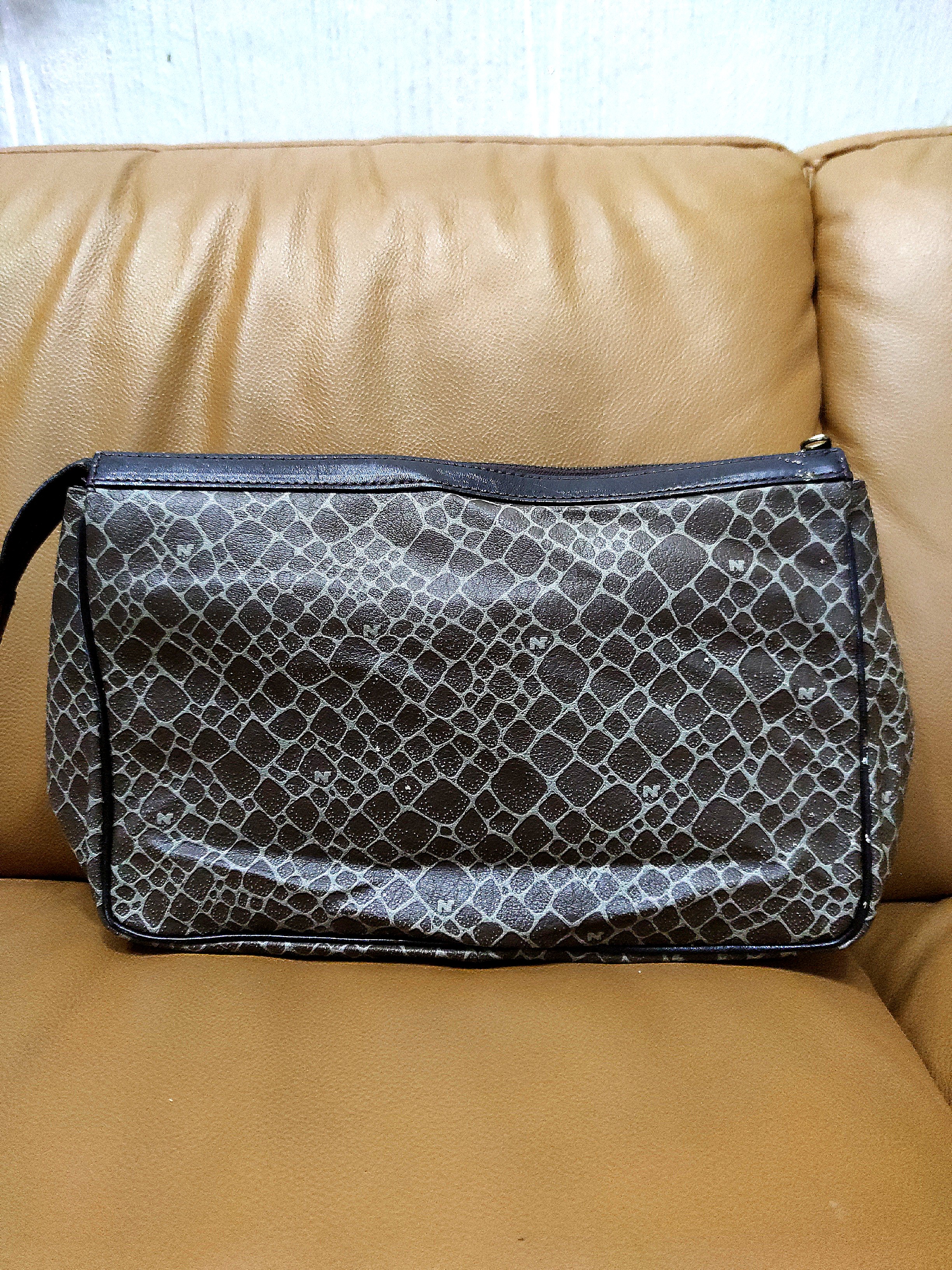 Nina ricci hotsell clutch bag