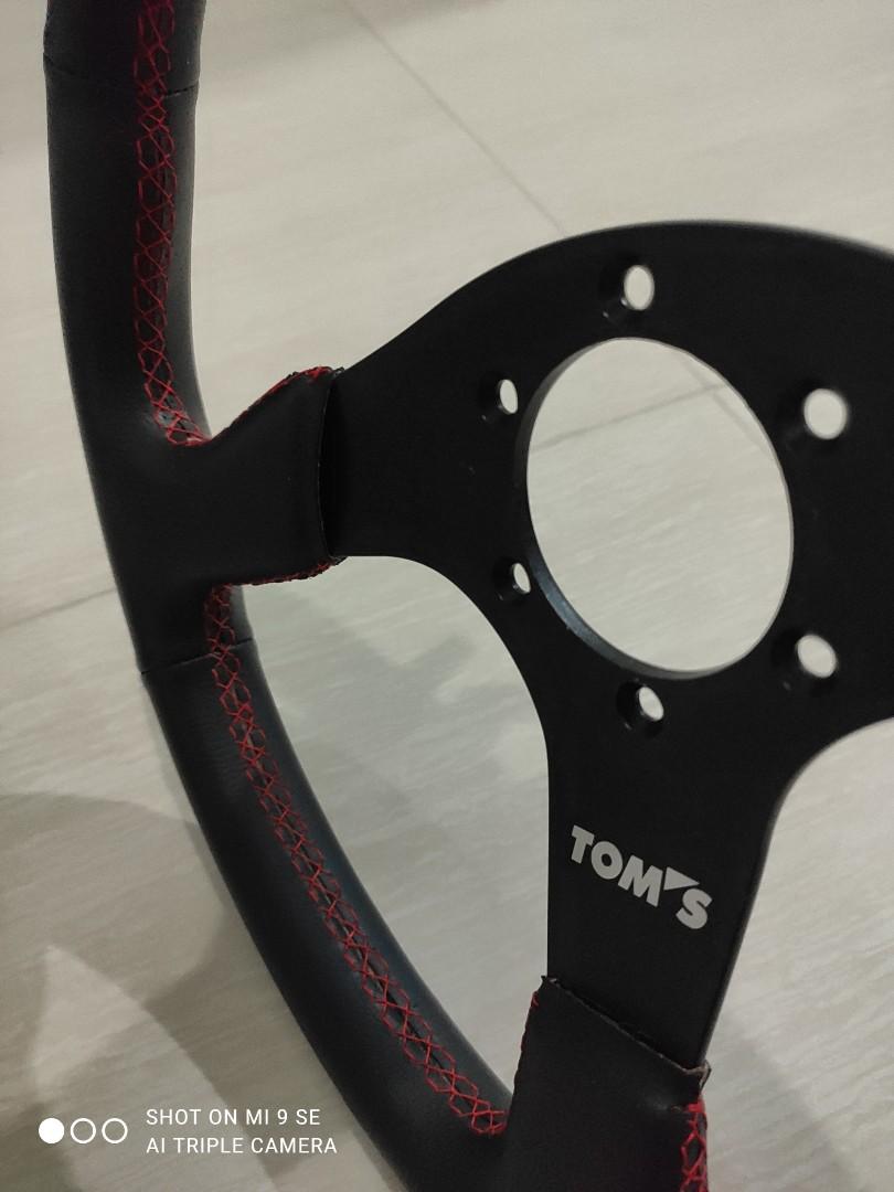 Tom's Steering Wheel with red stitching and horn button. (original