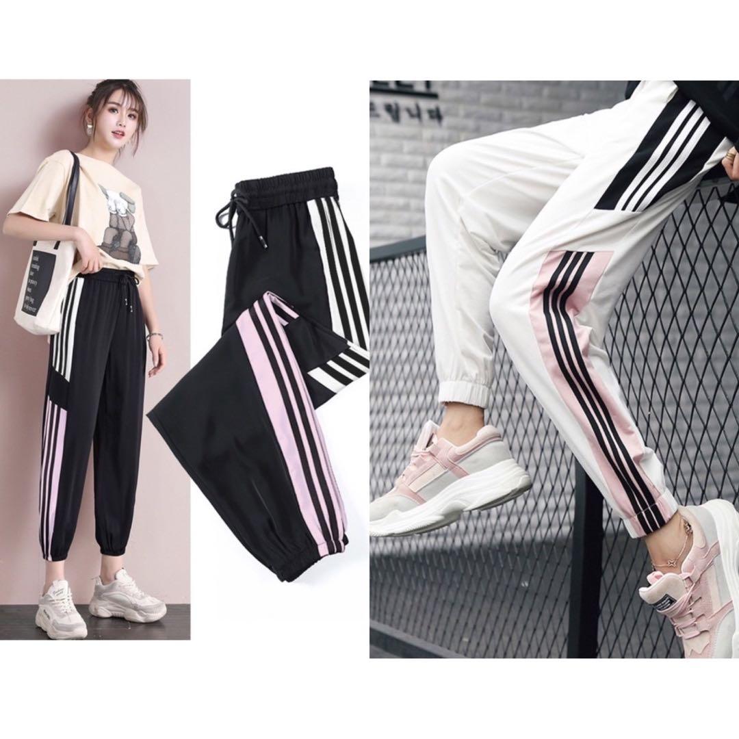 White sweatpants with black stripe store