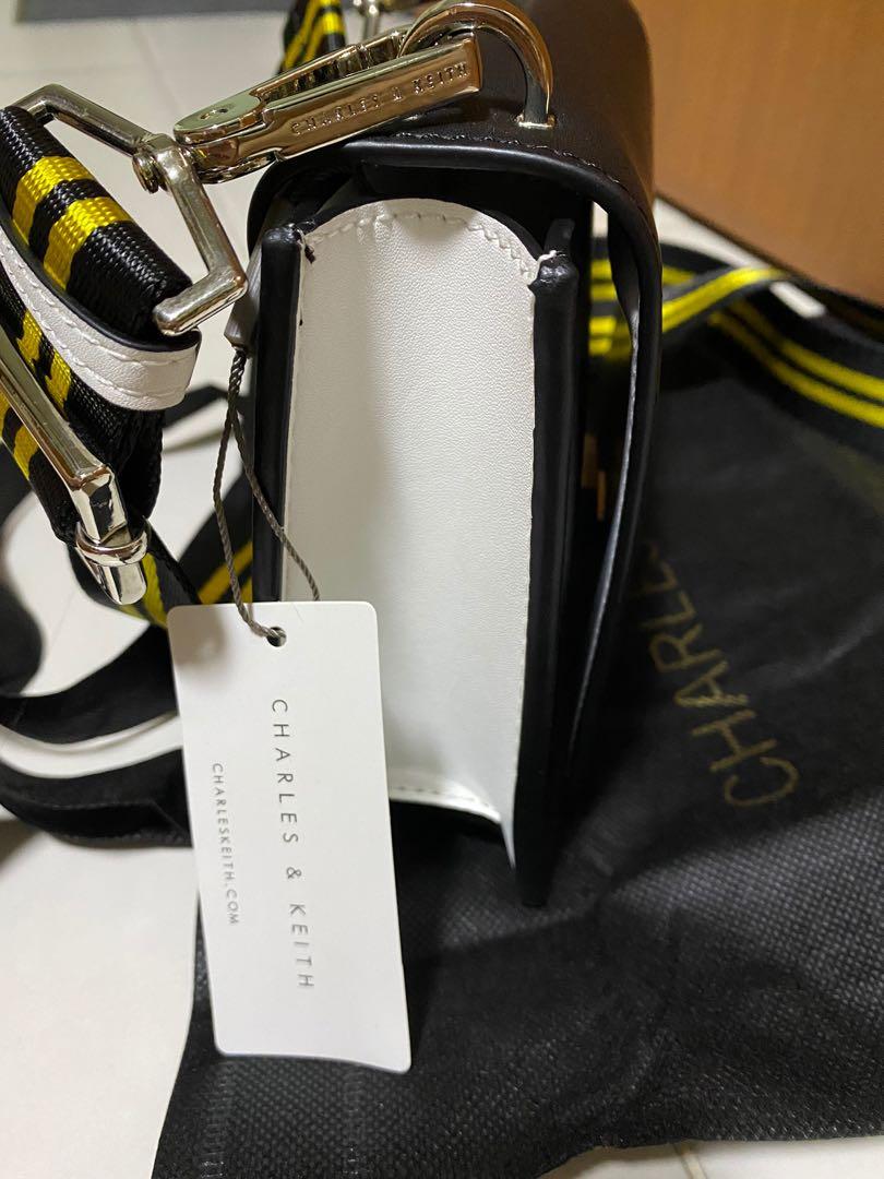 Black bag with yellow strap 2025