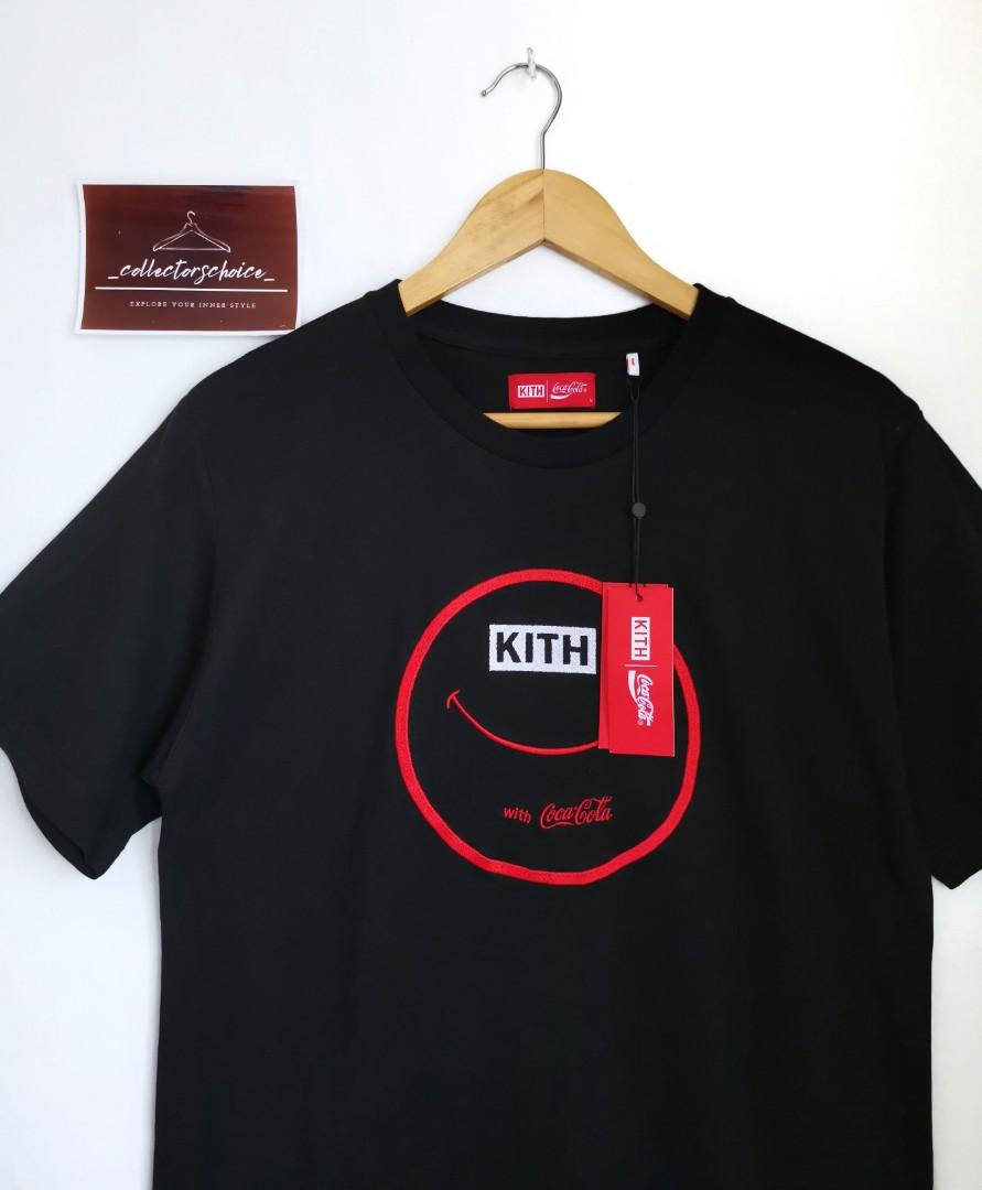 Kith x Coca-Cola Smile Tee (Category: Luxury Apparel) located in Makati City. Submitted by _collectorschoice_ (Listing ID 1088648554, Image 2). Description: Kith x Coca-Cola Smile Tee *Limited edition *Embroidered co-branded smile logo on front *Ribbed collar *250 GSM cotton fabric *Brand new *Unisex *Size on tag: Medium *Width: 20 inches *Length: 27 inches *MOP: BPI or Unionbank *Plus shipping fee *Courier: JRS only (home pick up MWF) *No rush s