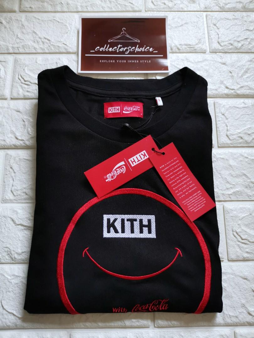 Kith x Coca-Cola Smile Tee (Category: Luxury Apparel) located in Makati City. Submitted by _collectorschoice_ (Listing ID 1088648554, Image 3). Description: Kith x Coca-Cola Smile Tee *Limited edition *Embroidered co-branded smile logo on front *Ribbed collar *250 GSM cotton fabric *Brand new *Unisex *Size on tag: Medium *Width: 20 inches *Length: 27 inches *MOP: BPI or Unionbank *Plus shipping fee *Courier: JRS only (home pick up MWF) *No rush s