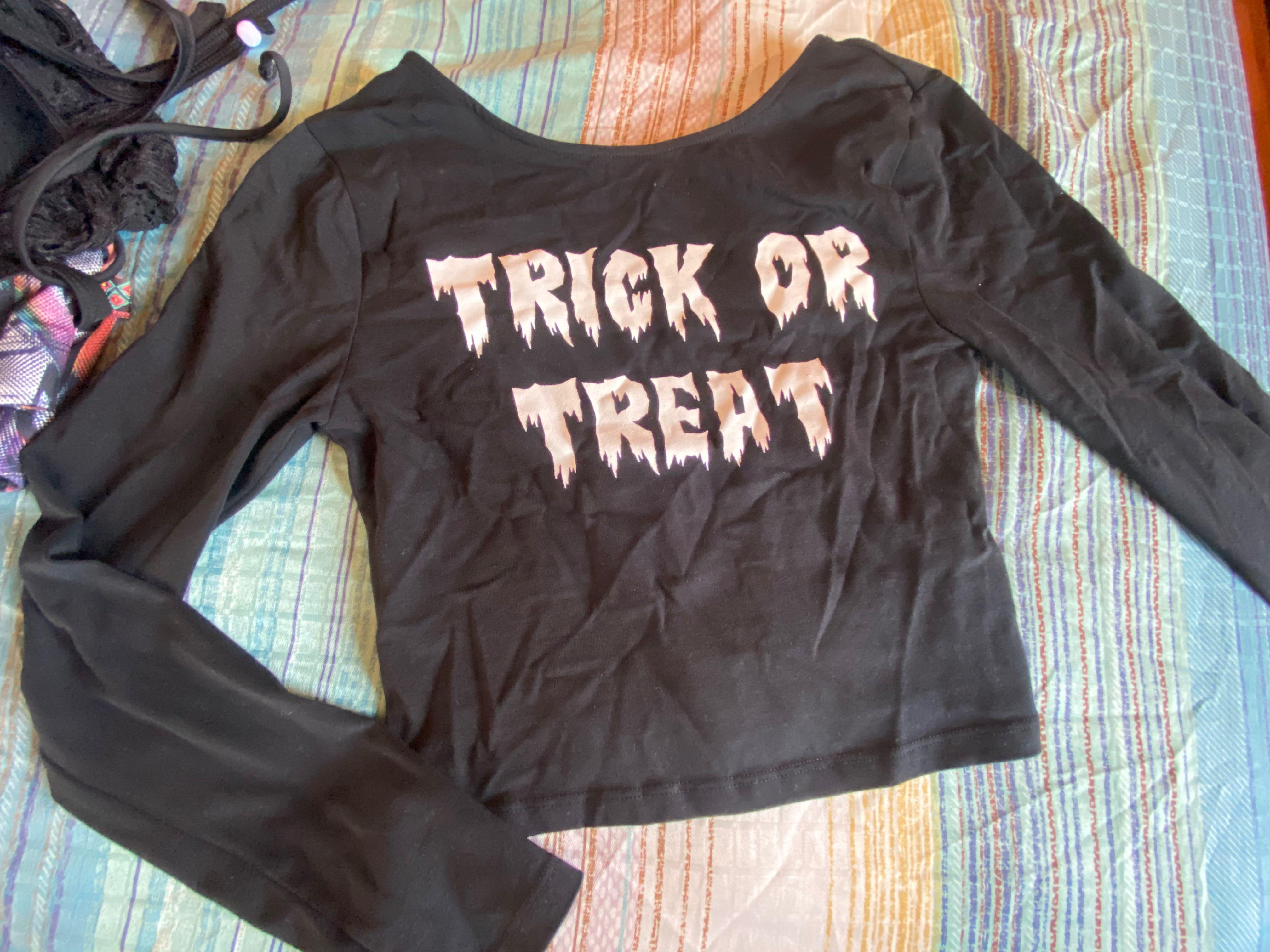 Trick or Treat Crop top black (Category: Longsleeves) located in Bacoor. Submitted by azs0713 (Listing ID 1088588914, Image 1). Description: - Used once - No damage - Good as new - Shopee check out for sure buyer - XS - Small .