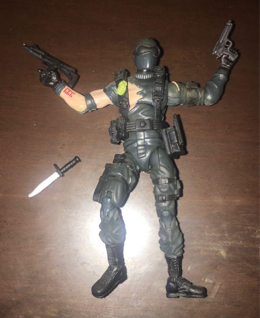 GI G.I. JOE TFAC BATTLE DAMAGED COMMANDO SNAKE EYES (Category: Action & Battle Toys) located in Makati City. Submitted by tudortiger2000 (Listing ID 1085176202, Image 2). Description: G.I. JOE 25th ANNIVERSARY COLLECTION (TFAC) BATTLE DAMAGED COMMANDO SNAKE EYES Hasbro 2008, Version 32 Comic pack with Storm Shadow (ver. 25) Accessories: - removable webgear - satchel - uzi submachine gun - pistol - dagger - character filecard - figure stand with n