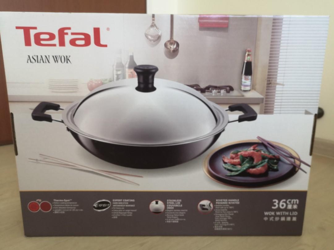https://media.karousell.com/media/photos/products/2021/5/2/tefal_asian_chinese_wok_with_l_1619940424_34de0bf1_progressive.jpg