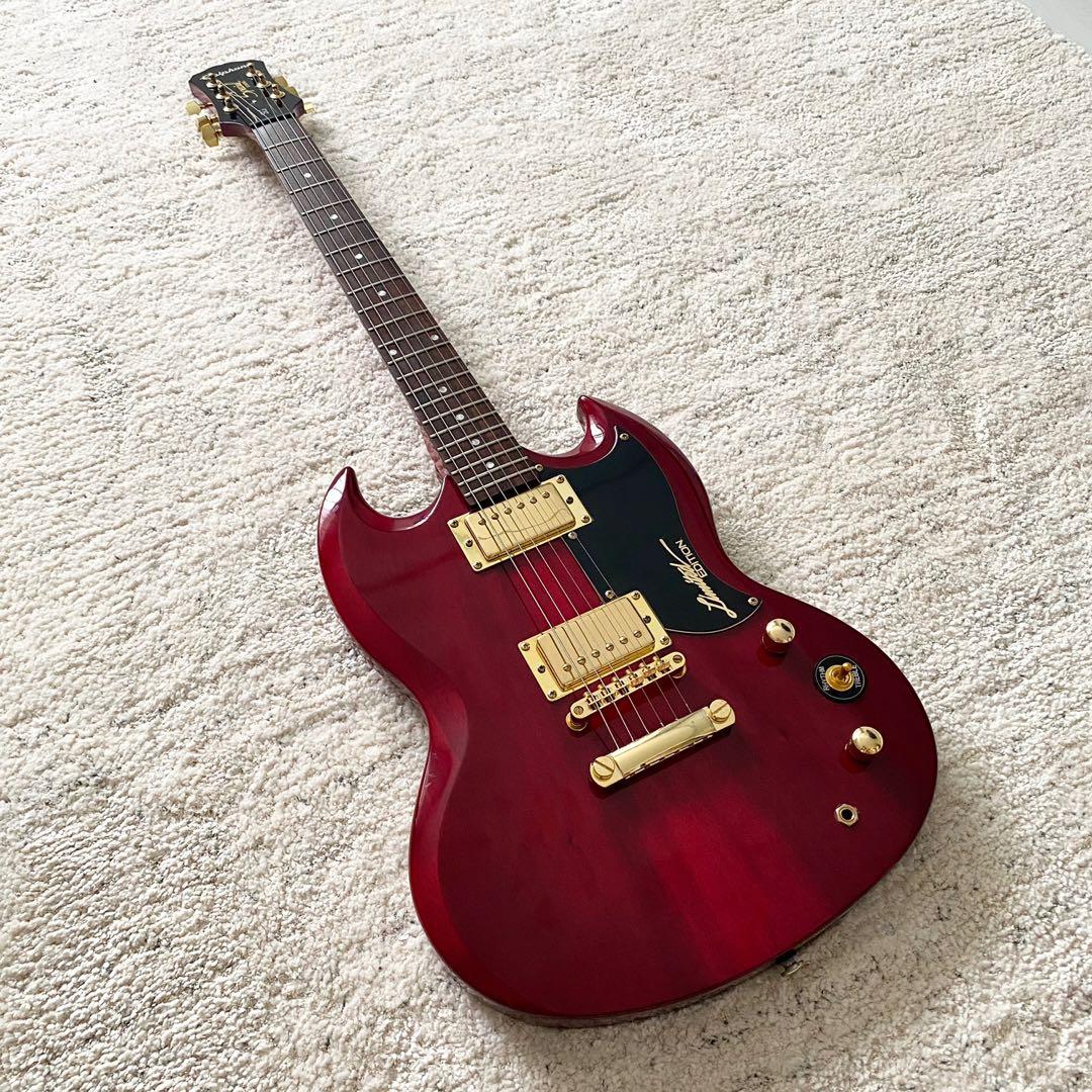 red and gold electric guitar