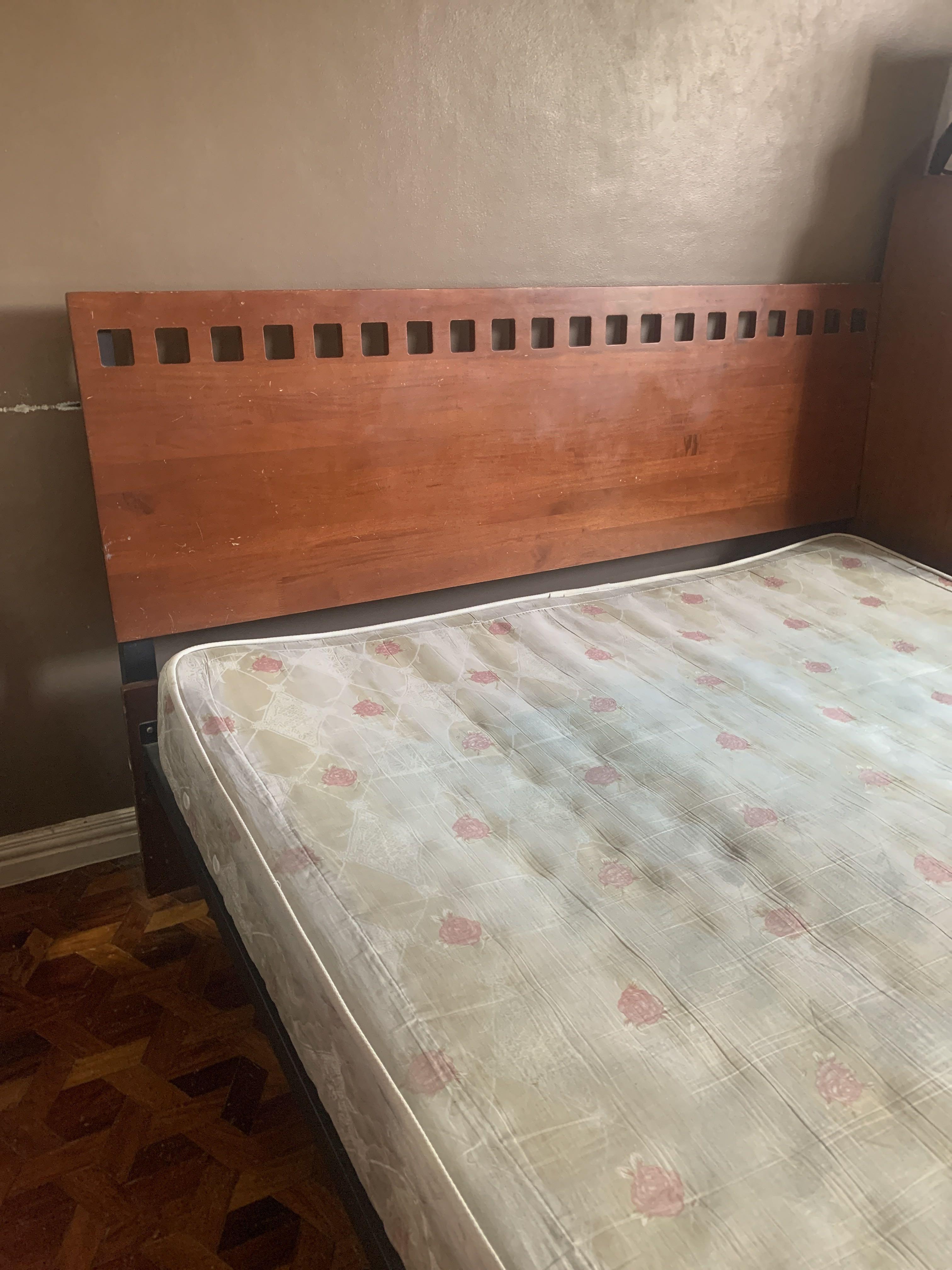 Queen size - Wooden and steel frame bed (Category: Bed Frames & Mattresses) located in Mandaluyong City. Submitted by malola (Listing ID 1088949006, Image 3). Description: Wooden bed with mattress for sale. Good quality. Used for guests in house. Not regularly used. Old with chips on wood looks rustic can be as is or repainted w varnish. Thick Mattress 7 1/2” high, hard good quality good for bad back. .