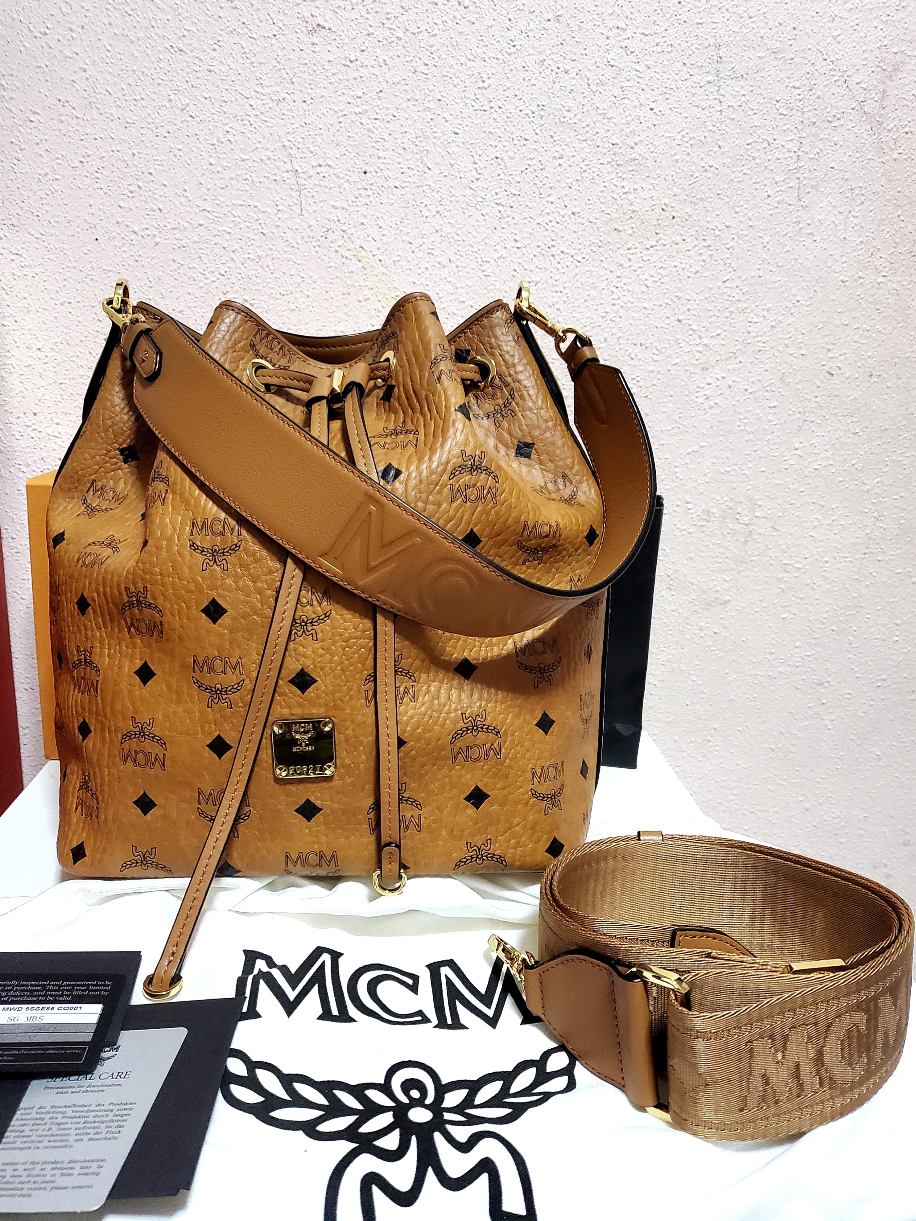 Mcm essential visetos sales original drawstring medium cognac