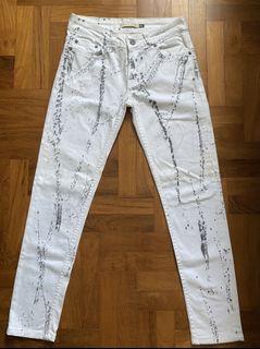 Christian Audigier white jeans
