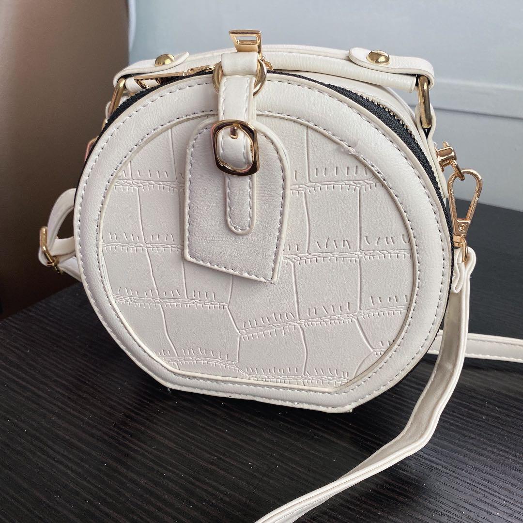 Round white hat box crossbody bag