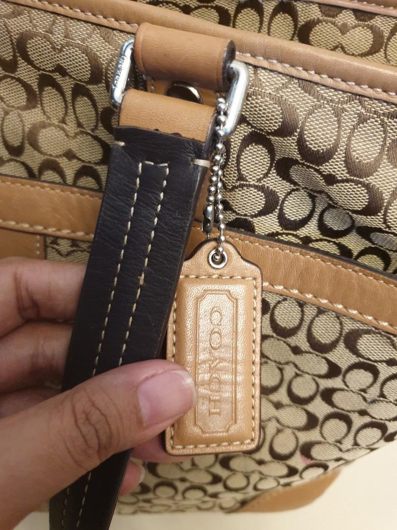 ORIGINAL COACH BROWN JACQUARD DIAPER BAG (Category: Luxury Bags & Wallets) located in Cabanatuan. Submitted by meyrasol (Listing ID 1087000244, Image 2). Description: signs of usage like corner wears and milk residue (washable lining naman) 35 x 29 x 12 cm.