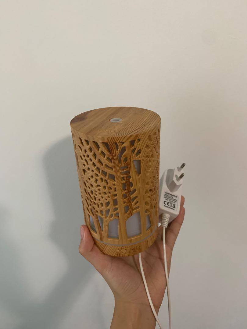 Wood diffuser (Category: Home Fragrance) located in Singapore. Submitted by dandeliondust (Listing ID 1089693205, Image 3). Description: Used a couple of times, no issues works well Decluttering at home, should go to someone who can use it! Able to change light to different colour options Meet ups at my convenience!.