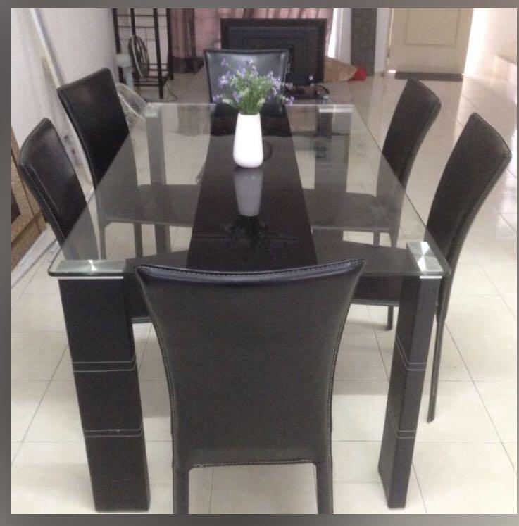 Dining Table Set (Category: Chairs) located in Shah Alam. Submitted by aswini86 (Listing ID 1089848065, Image 2). Description: Modern high quality 6 seater dining table with chairs Width 151cm Depth 90cm Height 76cm Table Legs can be dismantled for easy transportation Defect : small chip at corner (refer picture) Bought for RM1590 Selling due to shifting house Price negotiable.
