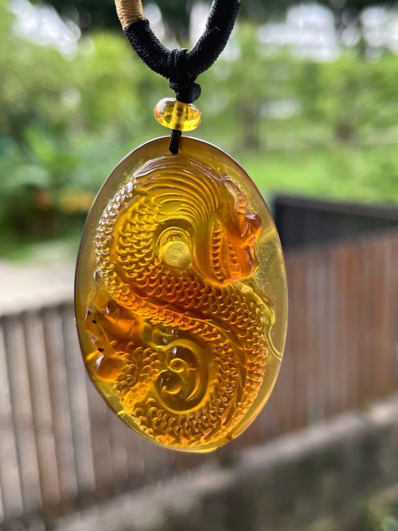 Carved deals amber pendant