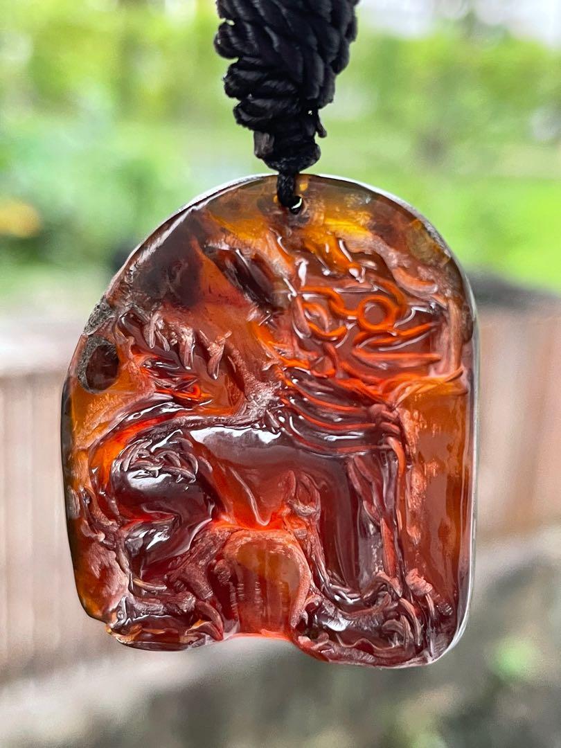 Carved deals amber pendant