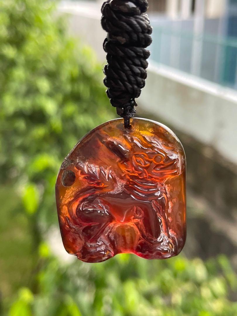 Carved deals amber pendant