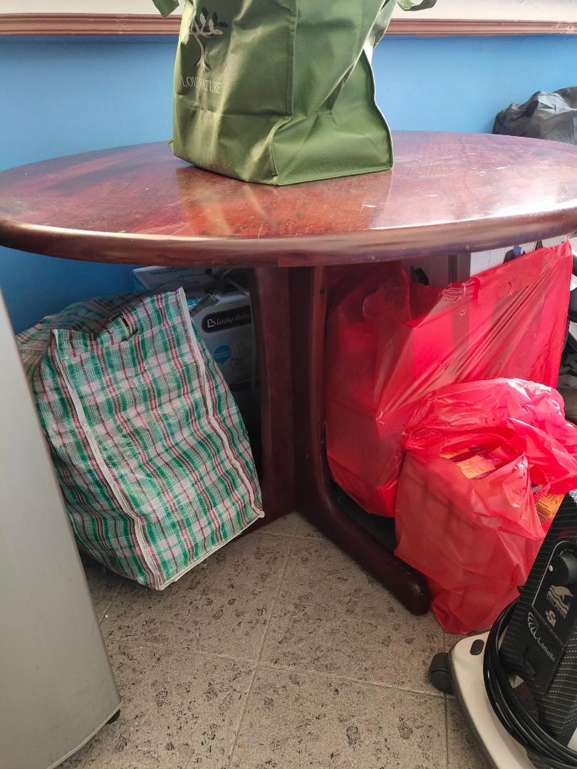 Solid round table (Category: Tables & Sets) located in Singapore. Submitted by four20 (Listing ID 1090059091, Image 2). Description: Very strong round solid wood table for sale. Condition 9/10. Size 103cm↔️ x 74cm↕️ Or you can offer me your reasonable price. Collection at Jurong West Street 42. Please ignore the mess..