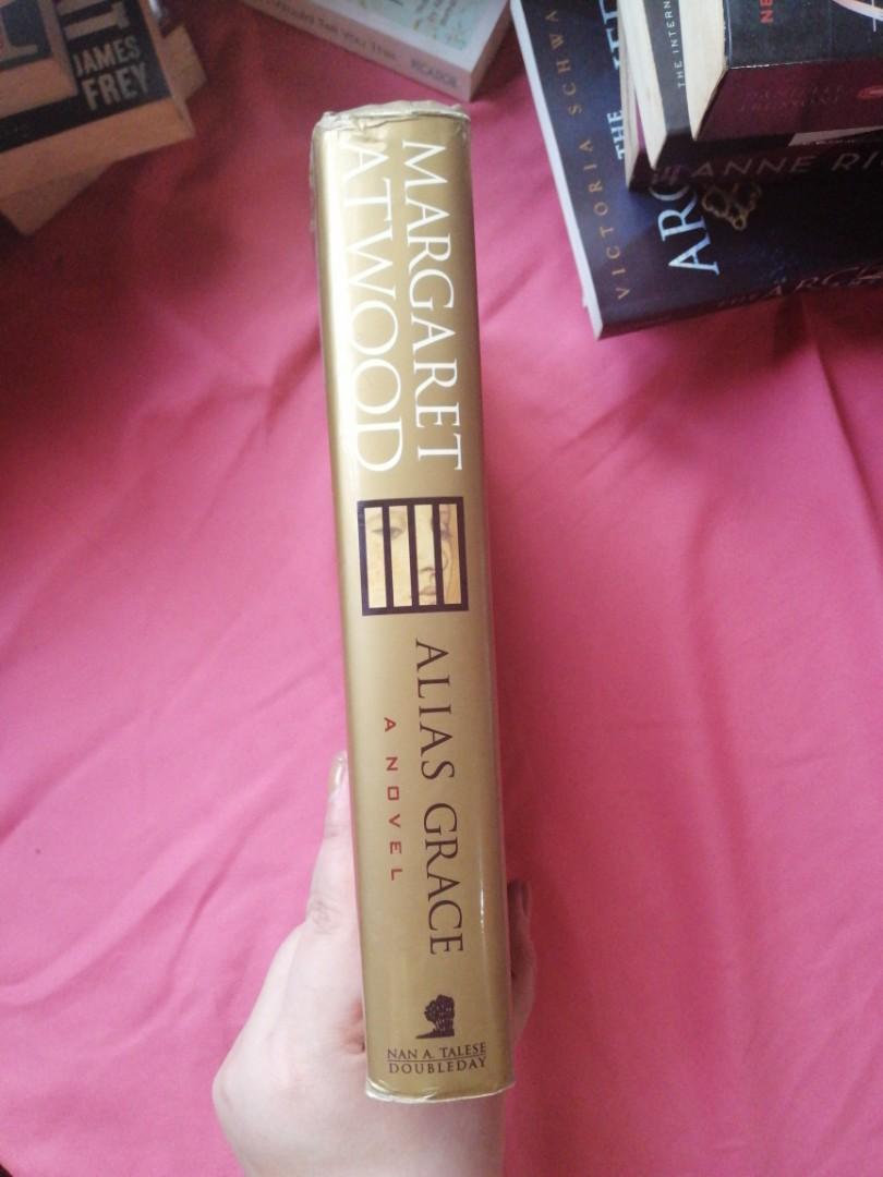 Alias Grace (Hardbound, First Edition) by Margaret Atwood (Category: Storybooks) located in Manila. Submitted by nikatsu.lib (Listing ID 1090257175, Image 3). Description: - Read once. - Duskjacket is scuffed at the edges. - Some weather and tear. - No highlights / annotations. - RFS: Decluttering my massive bookshelf. - Payment thru GCash on confirmation. - Shipping/Delivery c/o Buyer..